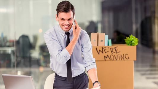 A man packing his office stuff ready for a move