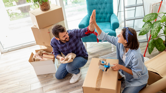 Happy couple fixing stuff ready for a move