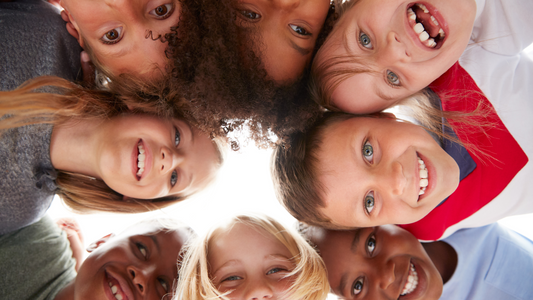 Group of Multicultural children looking down to the camera