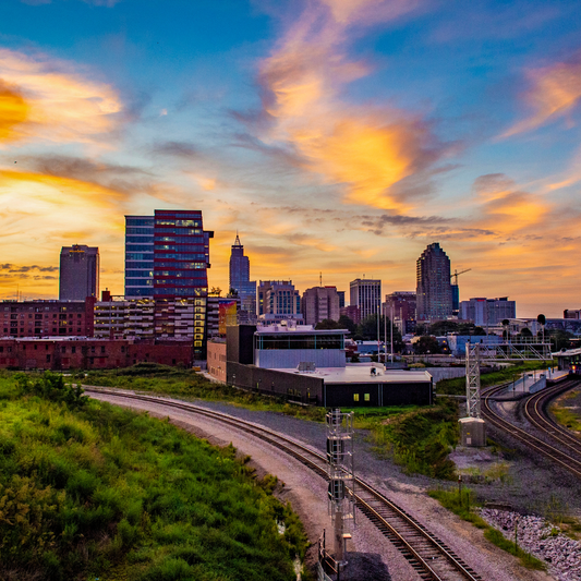 alt=”skyline view of Raleigh, North Carolina"