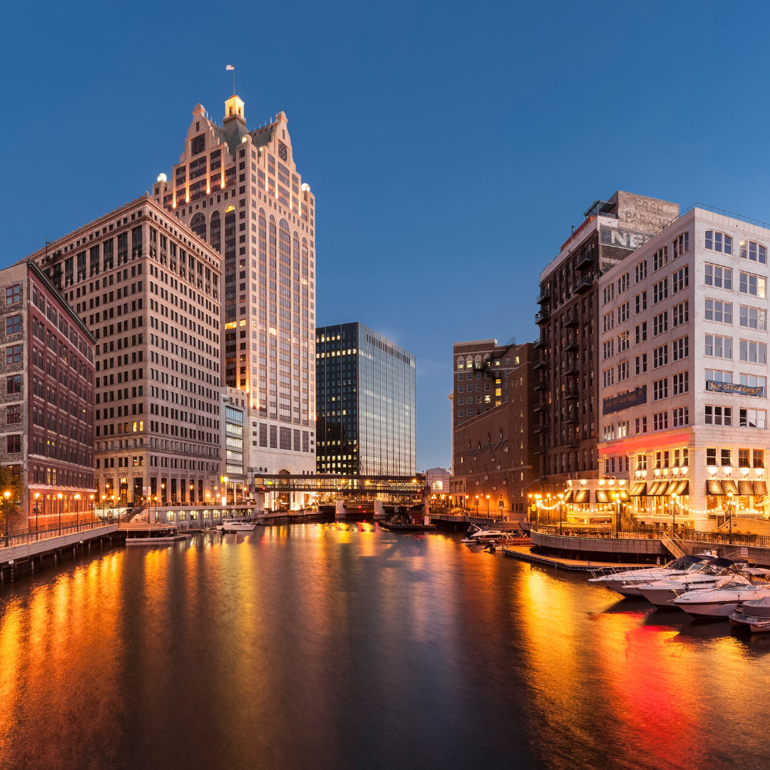 alt="late view with a high rise building in Milwaukee, WI"