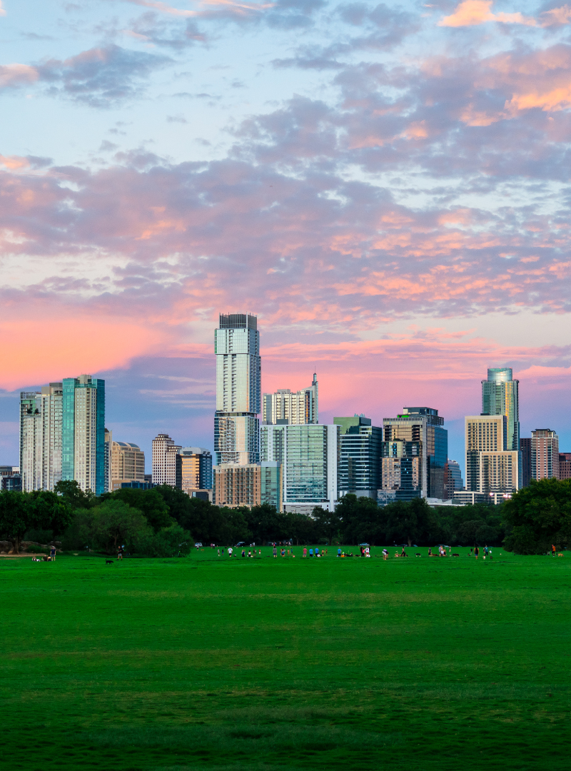 alt="a view of the austin skyline from zilker park during sunset"